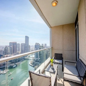 Cayan Tower Dubai Marina luxury apartment building exterior view.