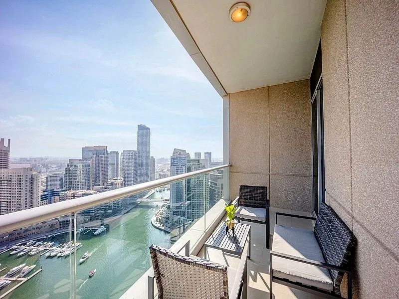 Cayan Tower Dubai Marina luxury apartment building exterior view.