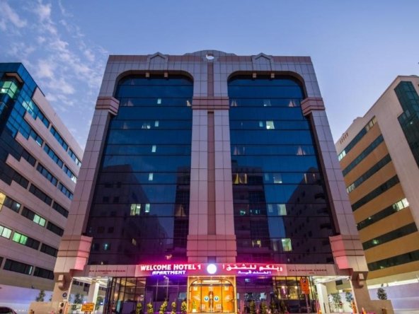 # Welcome Hotel Apartment 1 Fully Furnished Hotel Apartments in Bur Dubai, Dubai ## Meta Title Welcome Hotel Apartment 1 Serviced Hotel Apartments in Bur Dubai Near BurJuman Metro ## Meta Description Stay at Welcome Hotel Apartment 1 in Bur Dubai, offering fully furnished serviced apartments with free WiFi, rooftop swimming pool, fitness center, restaurant, free parking, and easy access to BurJuman Mall, Dubai Creek, and ADCB Metro Station. --- # Welcome Hotel Apartment 1 Experience the perfect blend of comfort, convenience, and affordability at Welcome Hotel Apartment 1, one of the most popular serviced apartment hotels in Bur Dubai. Ideally located in the Al Mankhool district, this property offers spacious, fully furnished apartments with modern amenities, making it an excellent choice for business travelers, families, tourists, and long-term guests. Situated just a short walk from ADCB Metro Station and BurJuman Mall, the hotel provides easy access to Dubai's top business districts, shopping destinations, cultural attractions, and entertainment venues. --- ## Property Overview Property Name Welcome Hotel Apartment 1 Property Type Serviced Hotel Apartments Location 19B Street, Al Mankhool, Bur Dubai, Dubai, UAE Accommodation Studio, One-Bedroom & Family Apartments Furnishing Fully Furnished Ideal For Families, Business Travelers, Couples & Long-Term Guests Nearest Metro ADCB Metro Station (Approximately 650 meters) Dubai International Airport Approximately 9 km (5.6 miles) --- # Spacious & Comfortable Hotel Apartments Each apartment at Welcome Hotel Apartment 1 is thoughtfully designed to provide the comfort of home while offering the convenience of hotel services. Large windows with blackout curtains allow plenty of natural light while ensuring complete privacy and restful sleep. The spacious living room includes comfortable seating and a dining area, creating the perfect space to relax after a busy day exploring Dubai. The fully equipped kitchen includes everything needed for self-catering, making these apartments ideal for both short and extended stays. ### Apartment Features Fully Furnished Apartments Spacious Living Room Comfortable Bedrooms Private Bathroom Fully Equipped Kitchen Stove & Microwave Refrigerator Washing Machine Kitchen Cabinets Dining Area Air Conditioning High-Speed Free WiFi Flat-Screen Television Modern Interior Design --- # Hotel Facilities & Amenities Guests enjoy a wide range of premium facilities designed for relaxation and convenience. ### Leisure Facilities Rooftop Outdoor Swimming Pool Hot Tub Jacuzzi Sun Deck Fitness Center Wellness Area ### Guest Services Free High-Speed WiFi 24-Hour Front Desk Restaurant Coffee Shop Room Service Daily Housekeeping Tour & Excursion Assistance Elevator Free On-Site Parking Family Rooms Non-Smoking Rooms Guests can also enjoy freshly prepared meals, snacks, coffee, and beverages at the hotel's restaurant and café throughout the day. --- # Prime Location in Bur Dubai Welcome Hotel Apartment 1 is located in the vibrant Al Mankhool neighborhood, offering excellent connectivity to Dubai's commercial and tourist attractions. ### Nearby Attractions BurJuman Mall Dubai Creek Meena Bazaar Al Seef Dubai Museum Al Fahidi Historical District Dubai Frame World Trade Centre Dubai Mall Burj Khalifa --- # Excellent Transport Connectivity The property is conveniently located close to public transportation, allowing guests to travel easily throughout Dubai. ADCB Metro Station – Approximately 650 meters Easy Access to Sheikh Zayed Road Taxi Services Available Bus Stops Nearby Dubai International Airport – Approximately 15 Minutes by Car --- # Why Choose Welcome Hotel Apartment 1 Whether you're visiting Dubai for business, shopping, or a family vacation, Welcome Hotel Apartment 1 provides exceptional value with spacious accommodation, modern facilities, and a central location. Guests appreciate the combination of hotel-quality services and apartment-style living, making it an ideal choice for both short and long-term stays. --- # Property Highlights Prime Bur Dubai Location Walking Distance to ADCB Metro Station Fully Furnished Apartments Rooftop Swimming Pool Fitness Center Hot Tub Restaurant & Coffee Shop Free High-Speed WiFi Free Parking Family-Friendly Accommodation Fully Equipped Kitchen Washing Machine Room Service 24-Hour Reception Close to BurJuman Mall Near Dubai Creek Ideal for Business & Leisure Travelers --- # Nearby Landmarks BurJuman Mall Dubai Creek Al Seef Dubai Frame Meena Bazaar Dubai Museum Dubai World Trade Centre Burj Khalifa Dubai Mall Dubai International Airport --- # Contact Information Agent Name Amir Iqbal Phone WhatsApp +92 303 9445392 Contact today to check room availability, long-term stay options, and special offers at Welcome Hotel Apartment 1. --- ## SEO Keywords Welcome Hotel Apartment 1, Welcome Hotel Apartments Dubai, hotel apartments in Bur Dubai, serviced apartments Dubai, furnished apartments Bur Dubai, hotel apartments near BurJuman Mall, apartments near ADCB Metro Station, family hotel apartments Dubai, long stay apartments Dubai, affordable hotel apartments Dubai, Bur Dubai accommodation, apartments with kitchen Dubai, hotel apartments with pool Dubai, Dubai serviced accommodation, furnished apartment rental Dubai.